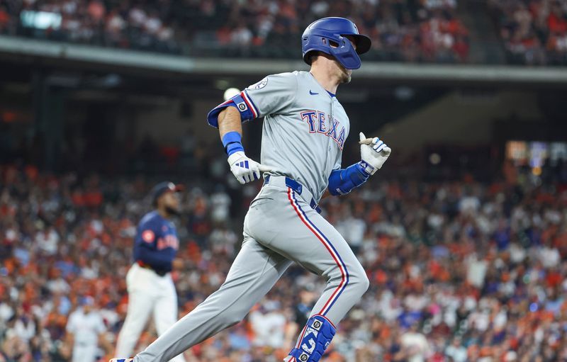 Apr 14, 2024; Houston, Texas, USA; Houston Astros pitcher Cristian Javier (53) reacts and Texas Rangers left fielder Evan Carter (32) runs to first base after hitting a home run during the fourth inning at Minute Maid Park. Mandatory Credit: Troy Taormina-USA TODAY Sports