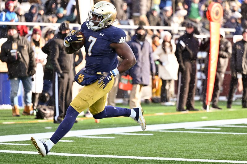 Nov 19, 2022; South Bend, Indiana, USA; Notre Dame Fighting Irish running back Audric Estime (7) runs for a touchdown in the second quarter against the Boston College Eagles at Notre Dame Stadium. Mandatory Credit: Matt Cashore-USA TODAY Sports