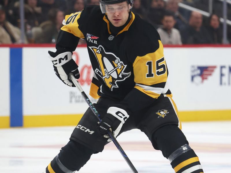 Nov 26, 2025; Pittsburgh, Pennsylvania, USA; Pittsburgh Penguins left wing Joona Koppanen (15) skates with the puck against the Buffalo Sabres during the third period at PPG Paints Arena. Mandatory Credit: Charles LeClaire-Imagn Images