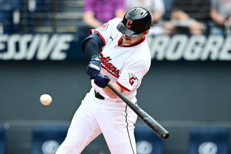 May 1, 2025; Cleveland, Ohio, USA; Cleveland Guardians first baseman Kyle Manzardo (9) hits an RBI single during the first inning against the Minnesota Twins at Progressive Field. Mandatory Credit: Ken Blaze-Imagn Images


