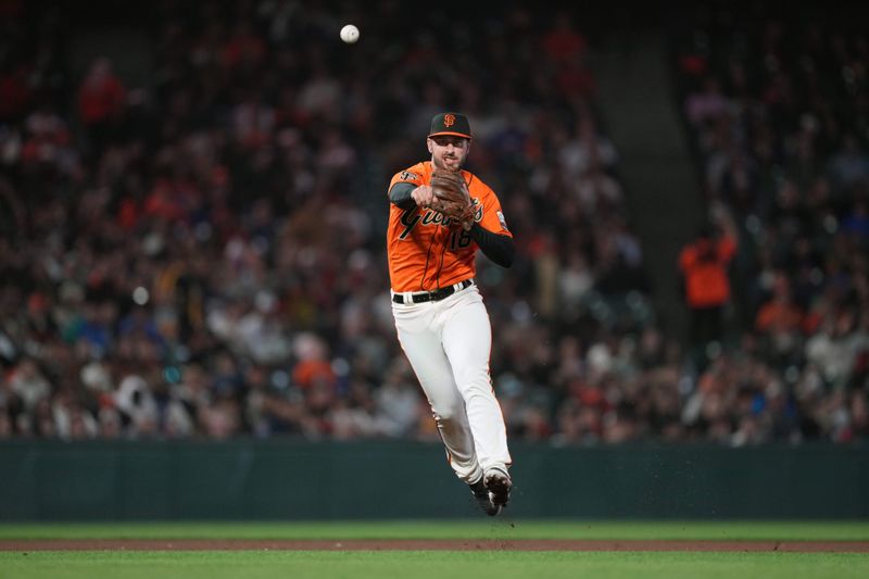 Aug 25, 2023; San Francisco, California, USA; San Francisco Giants shortstop Paul DeJong (18) throws the ball to first base during the fifth inning against the Atlanta Braves at Oracle Park. Mandatory Credit: Darren Yamashita-USA TODAY Sports