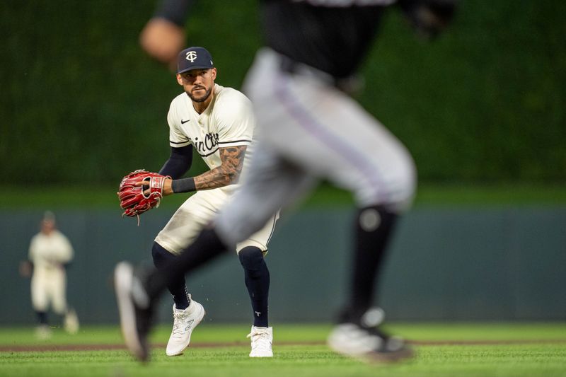 Sep 26, 2024; Minneapolis, Minnesota, USA; Minnesota Twins shortstop Carlos Correa (4) throws home by Miami Marlins shortstop Xavier Edwards (63) would be safe after Minnesota Twins catcher Ryan Jeffers (27) drops the ball in the fifth inning at Target Field. Mandatory Credit: Matt Blewett-Imagn Images