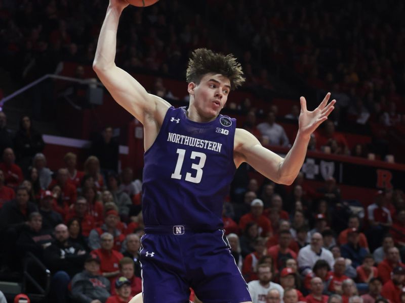 Mar 5, 2023; Piscataway, New Jersey, USA; Northwestern Wildcats guard Brooks Barnhizer (13) rebounds during the second half against the Rutgers Scarlet Knights at Jersey Mike's Arena. Mandatory Credit: Vincent Carchietta-USA TODAY Sports