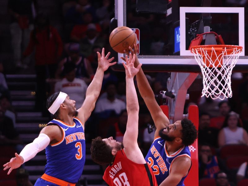 HOUSTON, TX - NOVEMBER 4: Karl-Anthony Towns #32 of the New York Knicks blocks the ball during the game against the Houston Rockets on November 4, 2024 at the Toyota Center in Houston, Texas. NOTE TO USER: User expressly acknowledges and agrees that, by downloading and or using this photograph, User is consenting to the terms and conditions of the Getty Images License Agreement. Mandatory Copyright Notice: Copyright 2024 NBAE (Photo by Michael Starghill Jr./NBAE via Getty Images)