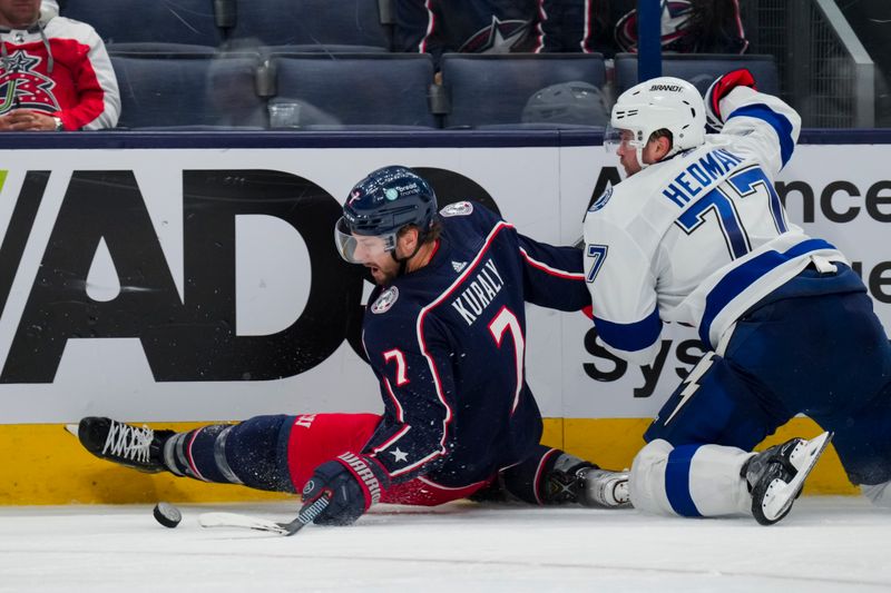 Nov 2, 2023; Columbus, Ohio, USA;  Columbus Blue Jackets center Sean Kuraly (7) skates for the puck as Tampa Bay Lightning defenseman Victor Hedman (77) is called for a holding penalty in the third period at Nationwide Arena. Mandatory Credit: Aaron Doster-USA TODAY Sports