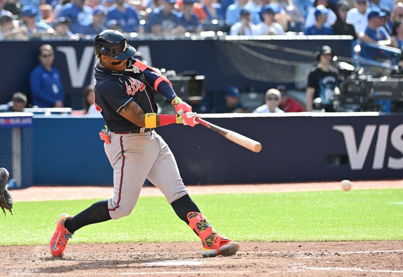 May 13, 2023; Toronto, Ontario, CAN; Atlanta Braves right fielder Ronald Acuna Jr. (13) hits a single against the Toronto Blue Jays in the seventh inning at Rogers Centre. Mandatory Credit: Dan Hamilton-USA TODAY Sports