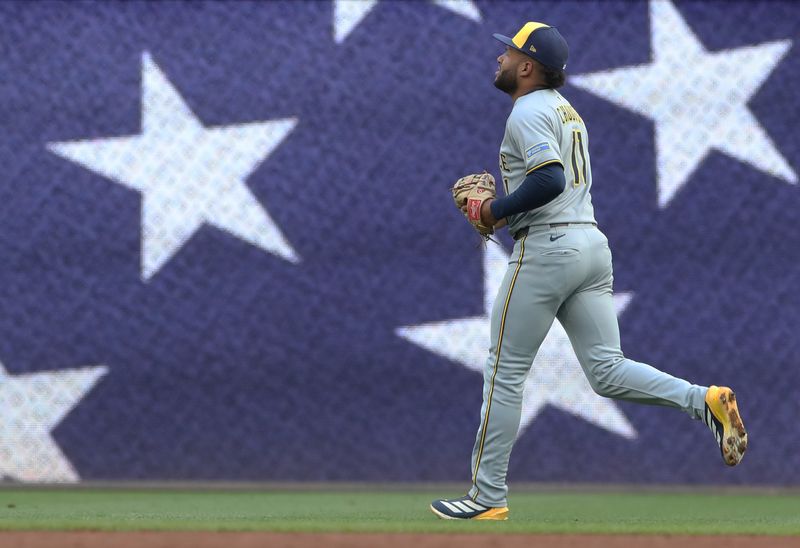 May 22, 2025; Pittsburgh, Pennsylvania, USA;  Milwaukee Brewers center fielder Jackson Chourio (11) jogs to his position against the Pittsburgh Pirates during the third inning at PNC Park. Mandatory Credit: Charles LeClaire-Imagn Images