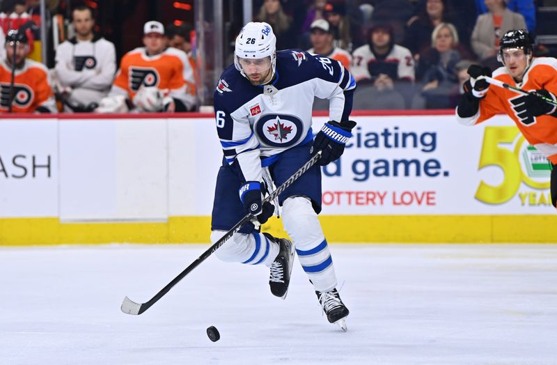 Jan 22, 2023; Philadelphia, Pennsylvania, USA; Winnipeg Jets right wing Blake Wheeler (26) reaches for the puck against the Philadelphia Flyers in the second period at Wells Fargo Center. Mandatory Credit: Kyle Ross-USA TODAY Sports