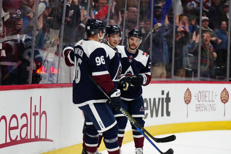 Feb 27, 2024; Denver, Colorado, USA; Colorado Avalanche left wing Artturi Lehkonen (62) celebrates his goal  with left wing Jonathan Drouin (27) and right wing Mikko Rantanen (96) in the second period against the Dallas Stars at Ball Arena. Mandatory Credit: Ron Chenoy-USA TODAY Sports