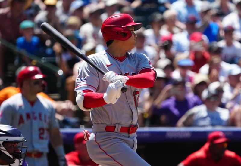 Jun 25, 2023; Denver, Colorado, USA; Los Angeles Angels starting pitcher Shohei Ohtani (17) hits a triple in the sixth inning against the Colorado Rockies in the at Coors Field. Mandatory Credit: Ron Chenoy-USA TODAY Sports