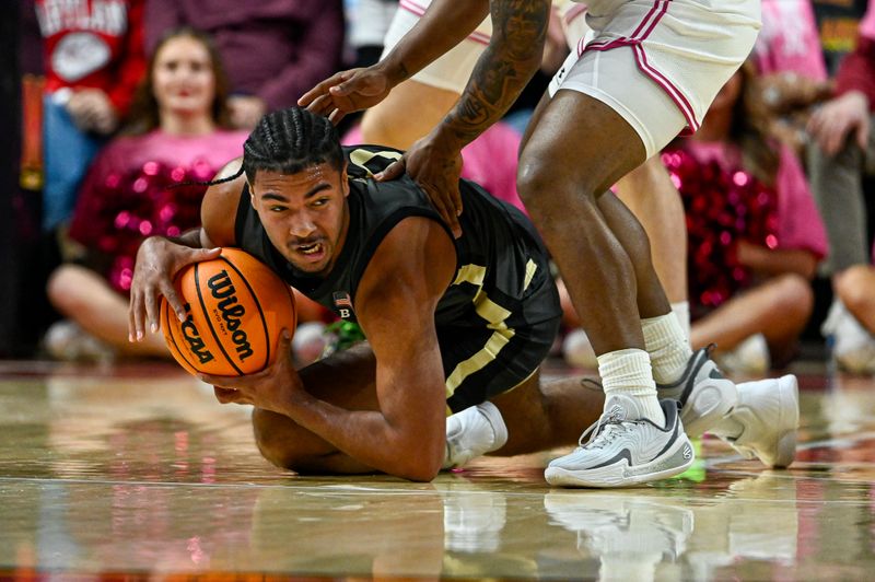 Feb 1, 2026; College Park, Maryland, USA;  Purdue Boilermakers guard C.j.c.ox (0) dives for a loose ball under Maryland Terrapins guard David Coit (8) during the first half at Xfinity Center. Mandatory Credit: Tommy Gilligan-Imagn Images