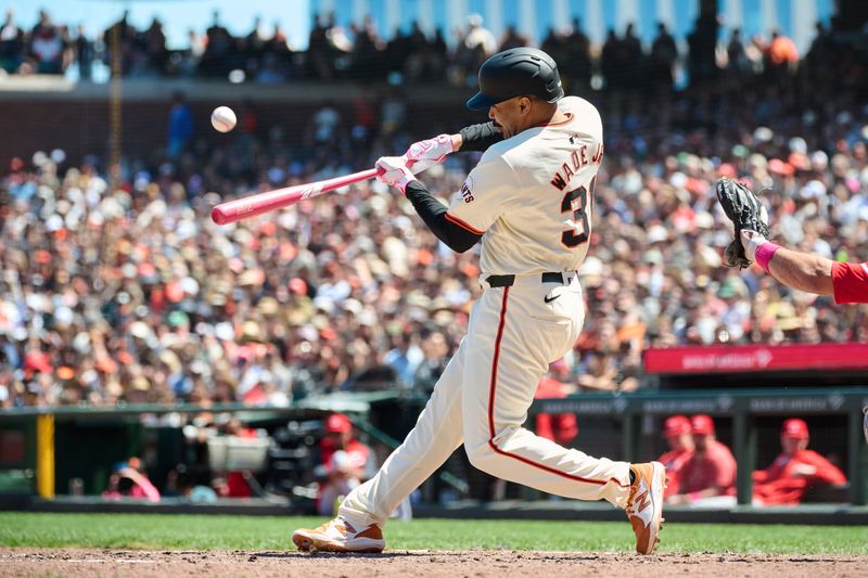 May 12, 2024; San Francisco, California, USA; San Francisco Giants infielder LaMonte Wade Jr. (31) hits a two run home run against the Cincinnati Reds during the fifth inning at Oracle Park. Mandatory Credit: Robert Edwards-USA TODAY Sports