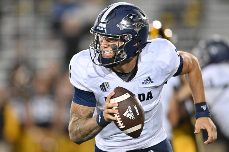 Sep 17, 2022; Iowa City, Iowa, USA; Nevada Wolf Pack quarterback Shane Illingworth (1) rolls out against the Iowa Hawkeyes during the fourth quarter at Kinnick Stadium. Mandatory Credit: Jeffrey Becker-USA TODAY Sports