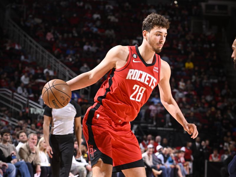 HOUSTON, TX - JANUARY 23:   Alperen Sengun #28 of the Houston Rockets drives to the basket during the game against the  Minnesota Timberwolves on January 23, 2023 at the Toyota Center in Houston, Texas. NOTE TO USER: User expressly acknowledges and agrees that, by downloading and or using this photograph, User is consenting to the terms and conditions of the Getty Images License Agreement. Mandatory Copyright Notice: Copyright 2023 NBAE (Photo by Logan Riely/NBAE via Getty Images)