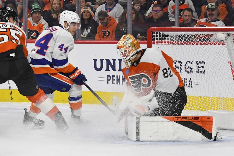 Jan 30, 2025; Philadelphia, Pennsylvania, USA; Philadelphia Flyers goaltender Ivan Fedotov (82) makes a save against New York Islanders center Jean-Gabriel Pageau (44) during the first period at Wells Fargo Center. Mandatory Credit: Eric Hartline-Imagn Images