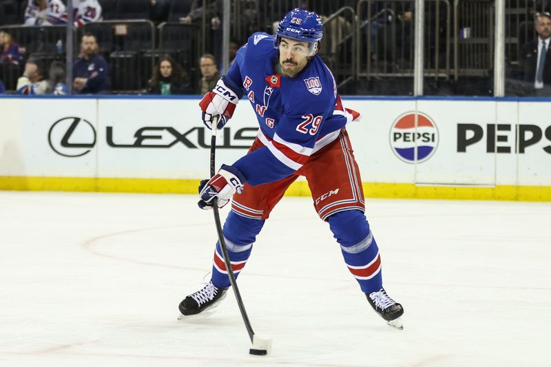 Nov 29, 2025; New York, New York, USA;  New York Rangers defenseman Matthew Robertson (29) controls the puck in the third period against the Tampa Bay Lightning at Madison Square Garden. Mandatory Credit: Wendell Cruz-Imagn Images