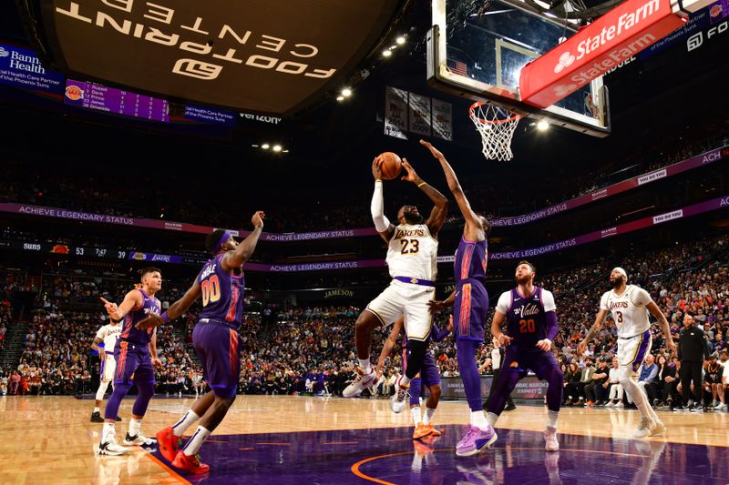 PHOENIX, AZ - FEBRUARY 25: LeBron James #23 of the Los Angeles Lakers drives to the basket during the game against the Phoenix Suns on February 25, 2024 at Footprint Center in Phoenix, Arizona. NOTE TO USER: User expressly acknowledges and agrees that, by downloading and or using this photograph, user is consenting to the terms and conditions of the Getty Images License Agreement. Mandatory Copyright Notice: Copyright 2024 NBAE (Photo by Kate Frese/NBAE via Getty Images)