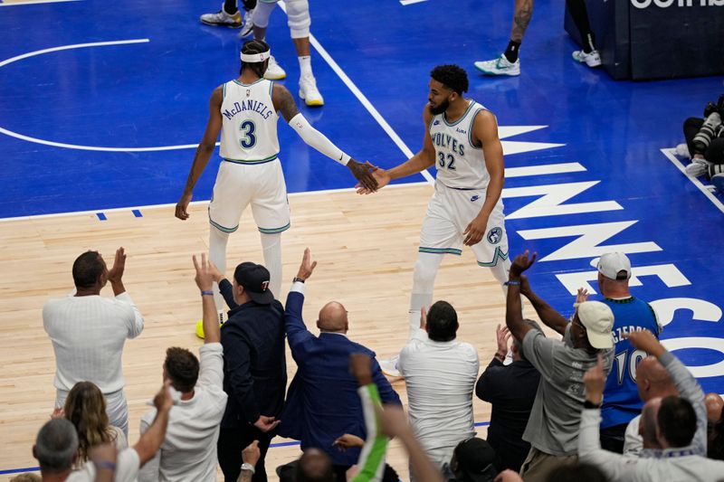 MINNEAPOLIS, MN -  MAY 24:  Karl-Anthony Towns #32 and Jaden McDaniels #3 of the Minnesota Timberwolves celebrate against the Dallas Mavericks during Round 3 Game 2 of the 2024 NBA Playoffs on May 24, 2024 at Target Center in Minneapolis, Minnesota. NOTE TO USER: User expressly acknowledges and agrees that, by downloading and or using this Photograph, user is consenting to the terms and conditions of the Getty Images License Agreement. Mandatory Copyright Notice: Copyright 2024 NBAE (Photo by Jordan Johnson/NBAE via Getty Images)