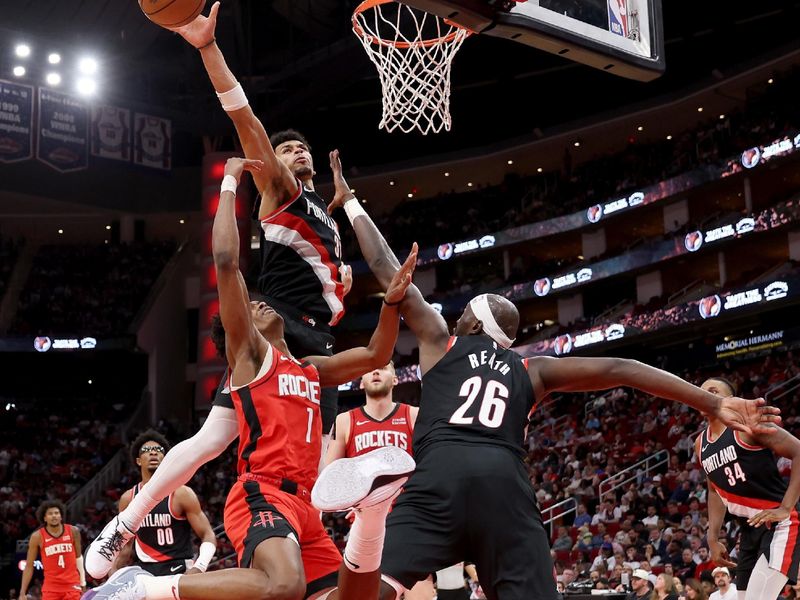 HOUSTON, TEXAS - MARCH 25: Toumani Camara #33 of the Portland Trail Blazers blocks a shot by Amen Thompson #1 of the Houston Rockets in the second half at Toyota Center on March 25, 2024 in Houston, Texas.  NOTE TO USER: User expressly acknowledges and agrees that, by downloading and or using this photograph, User is consenting to the terms and conditions of the Getty Images License Agreement. (Photo by Tim Warner/Getty Images)