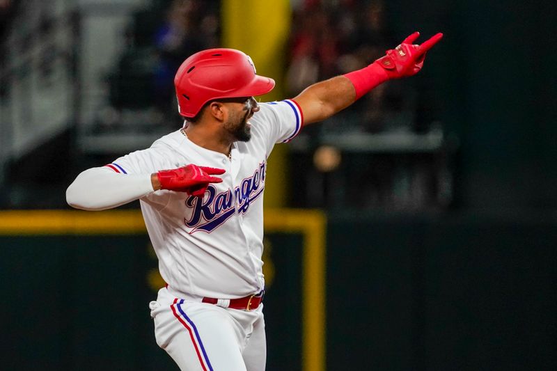 May 17, 2023; Arlington, Texas, USA; Texas Rangers shortstop Ezequiel Duran (20) reacts after hitting an RBI double against the Atlanta Braves during the fourth inning at Globe Life Field. Mandatory Credit: Raymond Carlin III-USA TODAY Sports