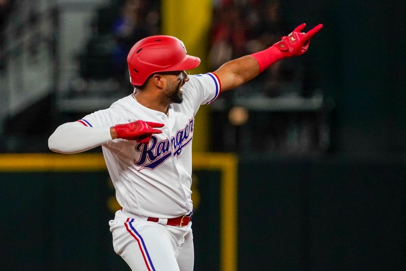 May 17, 2023; Arlington, Texas, USA; Texas Rangers shortstop Ezequiel Duran (20) reacts after hitting an RBI double against the Atlanta Braves during the fourth inning at Globe Life Field. Mandatory Credit: Raymond Carlin III-USA TODAY Sports