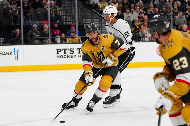 Dec 28, 2023; Las Vegas, Nevada, USA; Vegas Golden Knights defenseman Alex Pietrangelo (7) skates with the puck against Los Angeles Kings right wing Quinton Byfield (55) during the third period at T-Mobile Arena. Mandatory Credit: Lucas Peltier-USA TODAY Sports