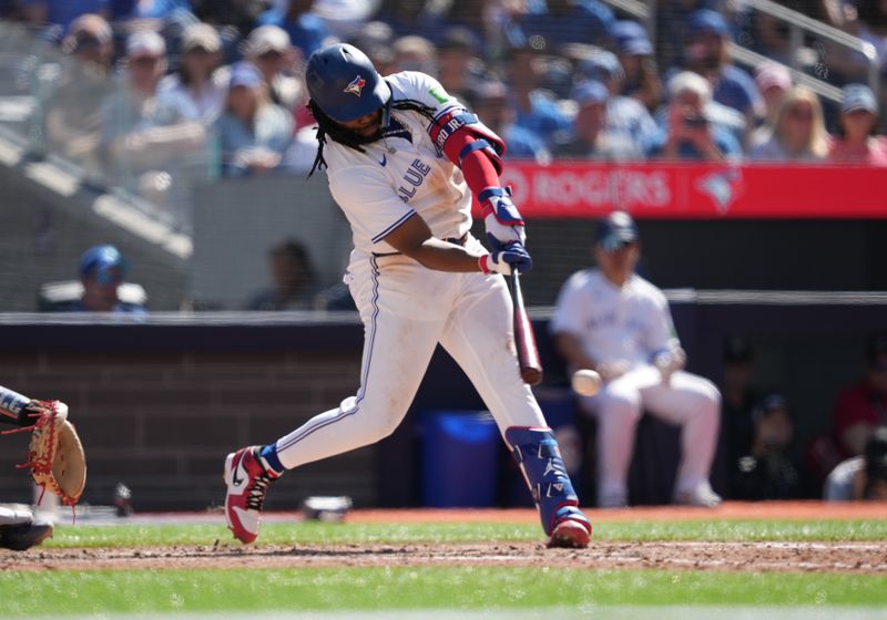 Jun 15, 2024; Toronto, Ontario, CAN; Toronto Blue Jays first base Vladimir Guerrero Jr. (27) hits a single against the Cleveland Guardians during the fifth inning at Rogers Centre. Mandatory Credit: Nick Turchiaro-USA TODAY Sports