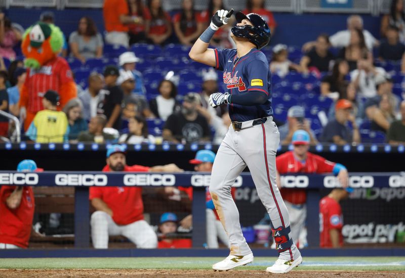 Sep 21, 2024; Miami, Florida, USA;  Atlanta Braves third baseman Gio Urshela (9) reacts after hitting a home run against the Miami Marlins in the seventh inning at loanDepot Park. Mandatory Credit: Rhona Wise-Imagn Images