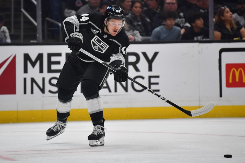 Dec 13, 2023; Los Angeles, California, USA; Los Angeles Kings defenseman Mikey Anderson (44) passes the puck against the Winnipeg Jets during the first period at Crypto.com Arena. Mandatory Credit: Gary A. Vasquez-USA TODAY Sports