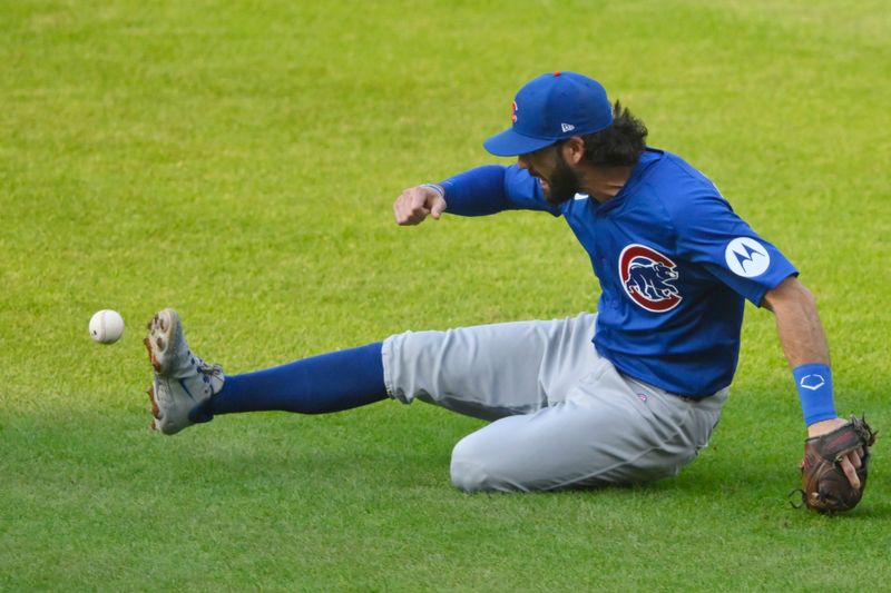 Aug 14, 2024; Cleveland, Ohio, USA; Chicago Cubs shortstop Dansby Swanson (7) attempts to field the ball on an infield single against the Cleveland Guardians in the second inning at Progressive Field. Mandatory Credit: David Richard-USA TODAY Sports