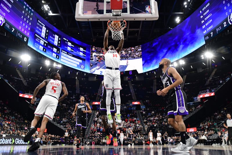 INGLEWOOD, CA - OCTOBER 17: Terance Mann #14 of the LA Clippers dunks the ball during the game against the Sacramento Kings during a NBA Preseason game on October 17, 2024 at Intuit Dome in Los Angeles, California. NOTE TO USER: User expressly acknowledges and agrees that, by downloading and/or using this Photograph, user is consenting to the terms and conditions of the Getty Images License Agreement. Mandatory Copyright Notice: Copyright 2024 NBAE (Photo by Adam Pantozzi/NBAE via Getty Images)