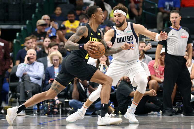 DALLAS, TEXAS - OCTOBER 10: John Collins #20 of the Utah Jazz drives to the basket against Klay Thompson #31 of the Dallas Mavericks in the first half at American Airlines Center on October 10, 2024 in Dallas, Texas. NOTE TO USER: User expressly acknowledges and agrees that, by downloading and or using this Photograph, user is consenting to the terms and conditions of the Getty Images License Agreement. Mandatory Copyright Notice: Copyright 2024 NBAE  (Photo by Tim Heitman/Getty Images)