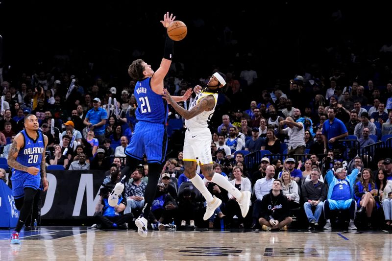 ORLANDO, FLORIDA - FEBRUARY 29: Moritz Wagner #21 of the Orlando Magic and Jordan Clarkson #00 of the Utah Jazz compete for a rebound during the fourth quarter at Kia Center on February 29, 2024 in Orlando, Florida. NOTE TO USER: User expressly acknowledges and agrees that, by downloading and or using this photograph, user is consenting to the terms and conditions of the Getty Images License Agreement. (Photo by Rich Storry/Getty Images)