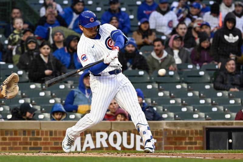 Apr 2, 2024; Chicago, Illinois, USA; Chicago Cubs right fielder Seiya Suzuki (27) hits a two-run home run against the Colorado Rockies during the first inning at Wrigley Field. Mandatory Credit: Matt Marton-USA TODAY Sports