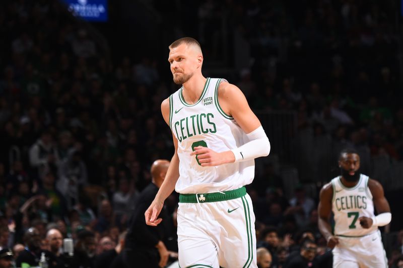 BOSTON, MA - MARCH 18: Kristaps Porzingis #8 of the Boston Celtics looks on during the game against the Detroit Pistons on March 18, 2024 at the TD Garden in Boston, Massachusetts. NOTE TO USER: User expressly acknowledges and agrees that, by downloading and or using this photograph, User is consenting to the terms and conditions of the Getty Images License Agreement. Mandatory Copyright Notice: Copyright 2024 NBAE  (Photo by Brian Babineau/NBAE via Getty Images)