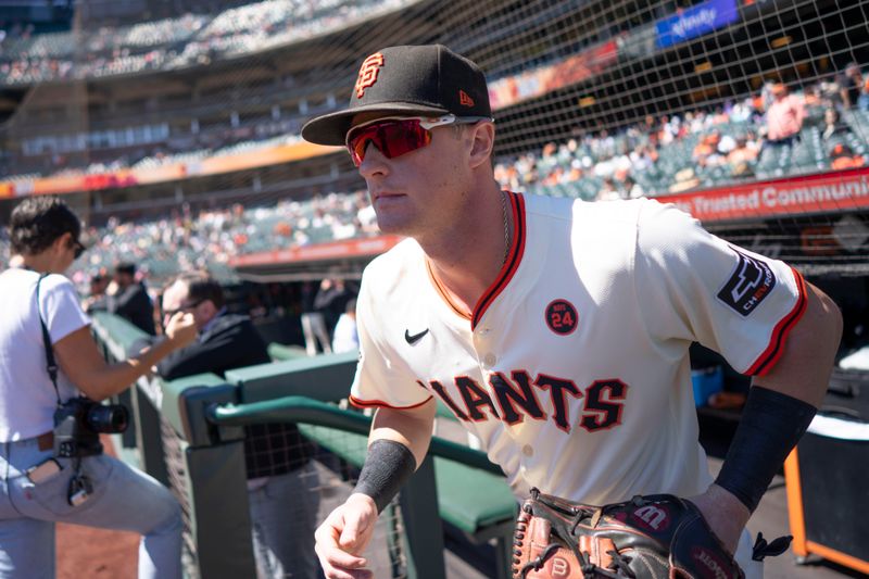 Sep 5, 2024; San Francisco, California, USA;  San Francisco Giants shortstop Tyler Fitzgerald (49) runs onto the field before the start of the first inning against the Arizona Diamondbacks at Oracle Park. Mandatory Credit: Stan Szeto-Imagn Images