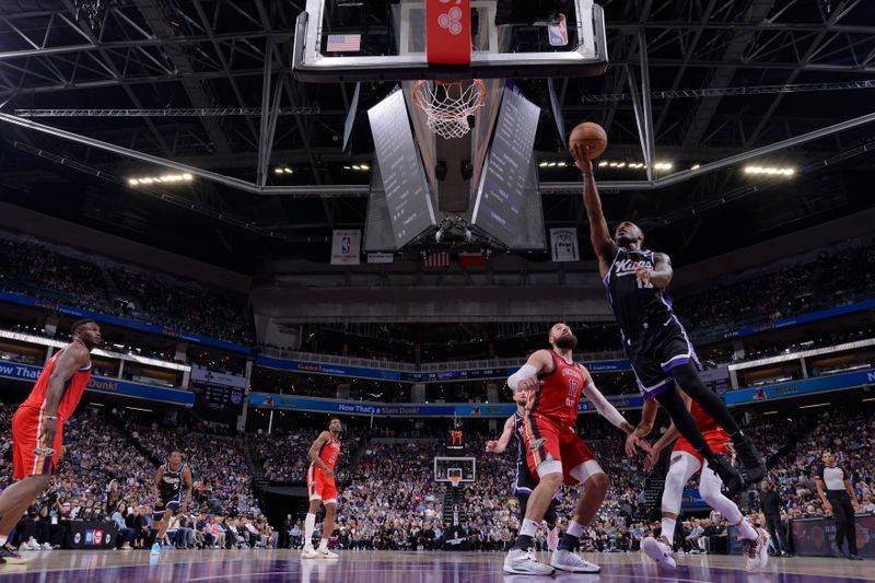 SACRAMENTO, CA - APRIL 11: Davion Mitchell #15 of the Sacramento Kings drives to the basket during the game against the New Orleans Pelicans on April 11, 2024 at Golden 1 Center in Sacramento, California. NOTE TO USER: User expressly acknowledges and agrees that, by downloading and or using this Photograph, user is consenting to the terms and conditions of the Getty Images License Agreement. Mandatory Copyright Notice: Copyright 2024 NBAE (Photo by Rocky Widner/NBAE via Getty Images)