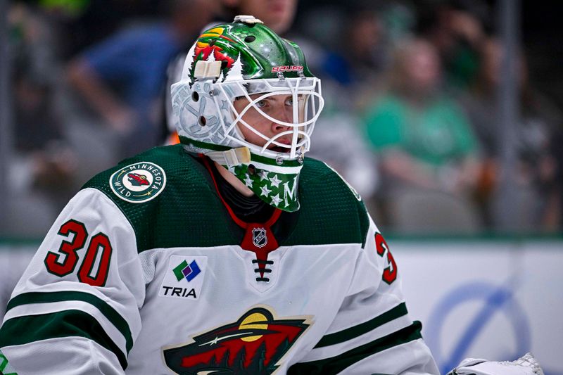 Sep 29, 2022; Dallas, Texas, USA; Minnesota Wild goaltender Jesper Wallstedt (30) faces the Dallas Stars attack during the second period at the American Airlines Center. Mandatory Credit: Jerome Miron-USA TODAY Sports