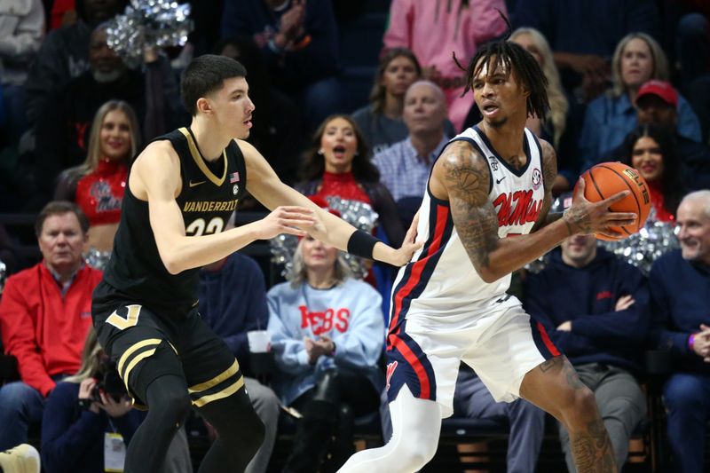 Jan 13, 2024; Oxford, Mississippi, USA; Mississippi Rebels guard Allen Flanigan (7) handles the ball against Vanderbilt Commodores guard/forward Jason Rivera-Torres (23) during the first half at The Sandy and John Black Pavilion at Ole Miss. Mandatory Credit: Petre Thomas-USA TODAY Sports