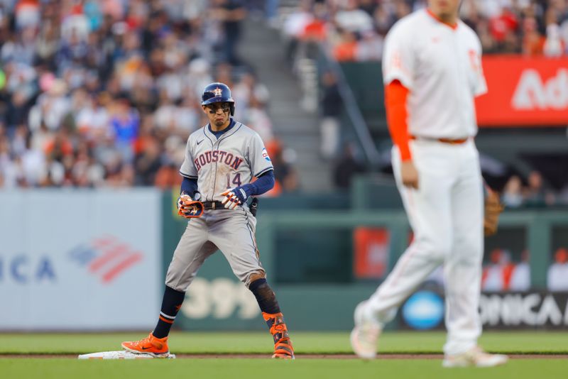 Jun 11, 2024; San Francisco, California, USA; Houston Astros outfielder Mauricio Dubón (14) reacts on second base after hitting a double during the fifth inning against the San Francisco Giants at Oracle Park. Mandatory Credit: Sergio Estrada-USA TODAY Sports