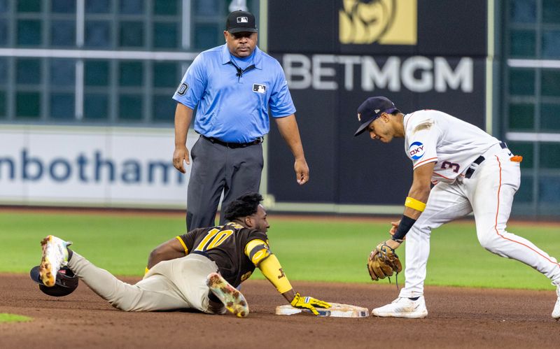 Sep 9, 2023; Houston, Texas, USA; San Diego Padres first baseman Jurickson Profar (10) slides into second safely as Houston Astros shortstop Jeremy Pena (3) is late with the tag  in the eighth inning at Minute Maid Park. Mandatory Credit: Thomas Shea-USA TODAY Sports