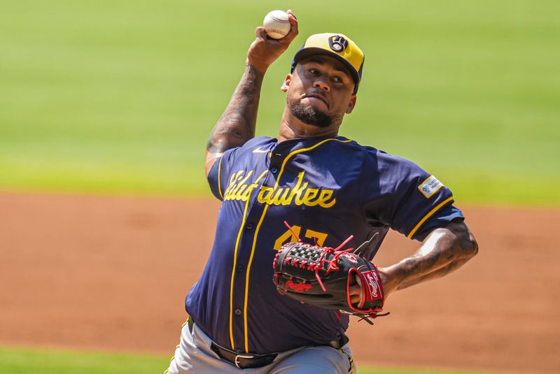 Aug 8, 2024; Cumberland, Georgia, USA; Milwaukee Brewers starting pitcher Frankie Montas (47) pitches against the Atlanta Braves during the first inning at Truist Park. Mandatory Credit: Dale Zanine-USA TODAY Sports