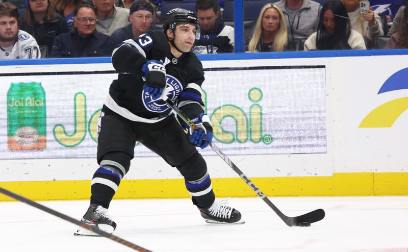 Nov 30, 2024; Tampa, Florida, USA; Toronto Maple Leafs left wing Matthew Knies (23) passes the puck against the Toronto Maple Leafs during the third period at Amalie Arena. Mandatory Credit: Kim Klement Neitzel-Imagn Images