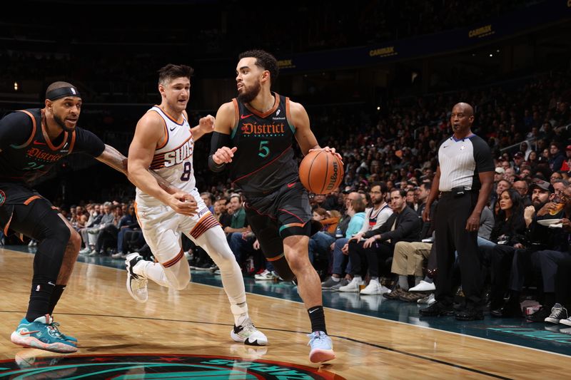 WASHINGTON, DC -? FEBRUARY 4: Tyus Jones #5 of the Washington Wizards dribbles the ball during the game against the Phoenix Suns on February 4, 2024 at Capital One Arena in Washington, DC. NOTE TO USER: User expressly acknowledges and agrees that, by downloading and or using this Photograph, user is consenting to the terms and conditions of the Getty Images License Agreement. Mandatory Copyright Notice: Copyright 2024 NBAE (Photo by Stephen Gosling/NBAE via Getty Images)