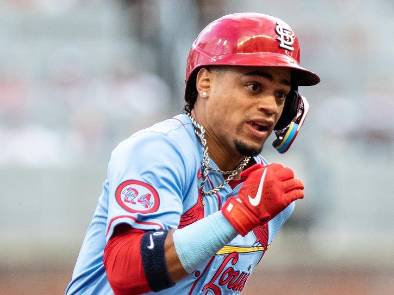 Jul 20, 2024; Cumberland, Georgia, USA; .St. Louis Cardinals third base Nolan Arenado (28) runs the bases after hitting a triple against the Atlanta Braves during the second inning at Truist Park. Mandatory Credit: Jordan Godfree-USA TODAY Sports