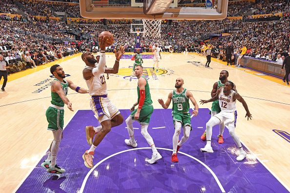 LOS ANGELES, CA - DECEMBER 25: LeBron James #23 of the Los Angeles Lakers drives to the basket during the game Boston Celtics on December 25, 2023 at Crypto.Com Arena in Los Angeles, California. NOTE TO USER: User expressly acknowledges and agrees that, by downloading and/or using this Photograph, user is consenting to the terms and conditions of the Getty Images License Agreement. Mandatory Copyright Notice: Copyright 2023 NBAE (Photo by Andrew D. Bernstein/NBAE via Getty Images)