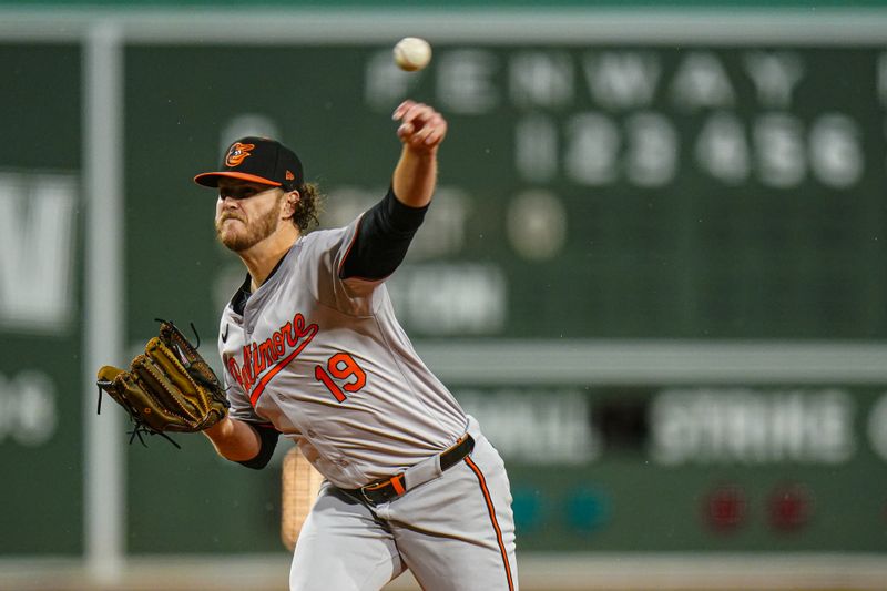 Apr 10, 2024; Boston, Massachusetts, USA; Baltimore Orioles pitcher Cole Irvin (19) throws a pitch against the Boston Red Sox in the first inning at Fenway Park. Mandatory Credit: David Butler II-USA TODAY Sports