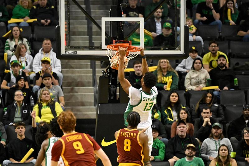 Dec 2, 2025; Eugene, Oregon, USA; Oregon Ducks forward Sean Stewart (13) dunks the ball during the second half against the Southern California Trojans at Matthew Knight Arena. Mandatory Credit: Craig Strobeck-Imagn Images