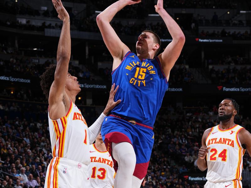 DENVER, CO - APRIL 6: Nikola Jokic #15 of the Denver Nuggets shoots the ball during the game against the Atlanta Hawks on April 6, 2024 at the Ball Arena in Denver, Colorado. NOTE TO USER: User expressly acknowledges and agrees that, by downloading and/or using this Photograph, user is consenting to the terms and conditions of the Getty Images License Agreement. Mandatory Copyright Notice: Copyright 2024 NBAE (Photo by Garrett Ellwood/NBAE via Getty Images)