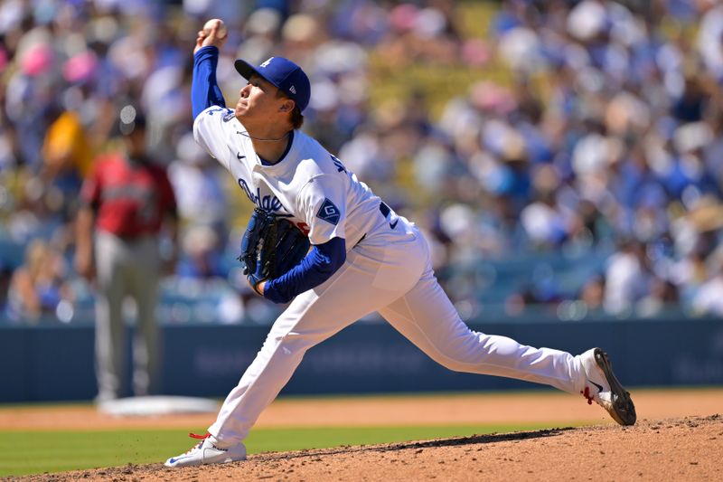 Aug 31, 2025; Los Angeles, California, USA;  Los Angeles Dodgers starting pitcher Yoshinobu Yamamoto (18) delivers to the plate during the seventh inning against the Arizona Diamondbacks at Dodger Stadium. Mandatory Credit: Jayne Kamin-Oncea-Imagn Images